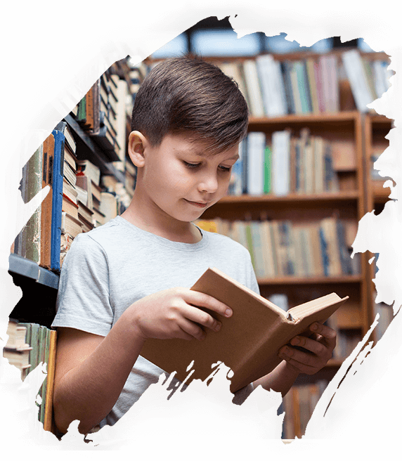  A happy child enjoying reading the nurture magazine from a library